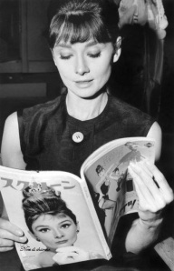 Audrey reading a fashion magazine